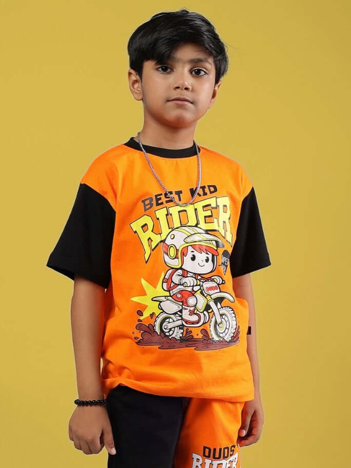 Child wearing Rogue Rider T-shirt in black-orange, featuring cartoon rider graphic. Ideal for boys & girls. Custom fits available.