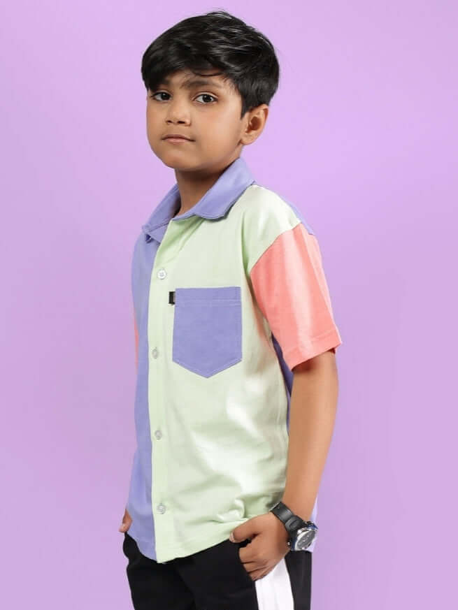 Child wearing ROMAN SHIRT FOR BOYS & GIRLS MULTI with playful colors, showcasing its streetwear-inspired style and comfort.