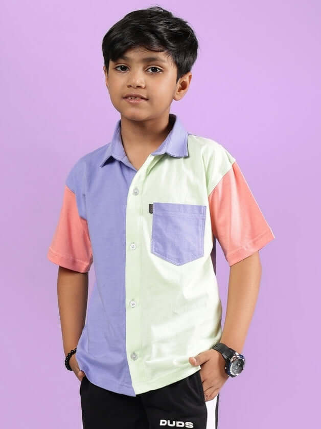 Boy wearing ROMAN SHIRT FOR BOYS & GIRLS MULTI in colorful pastel design.