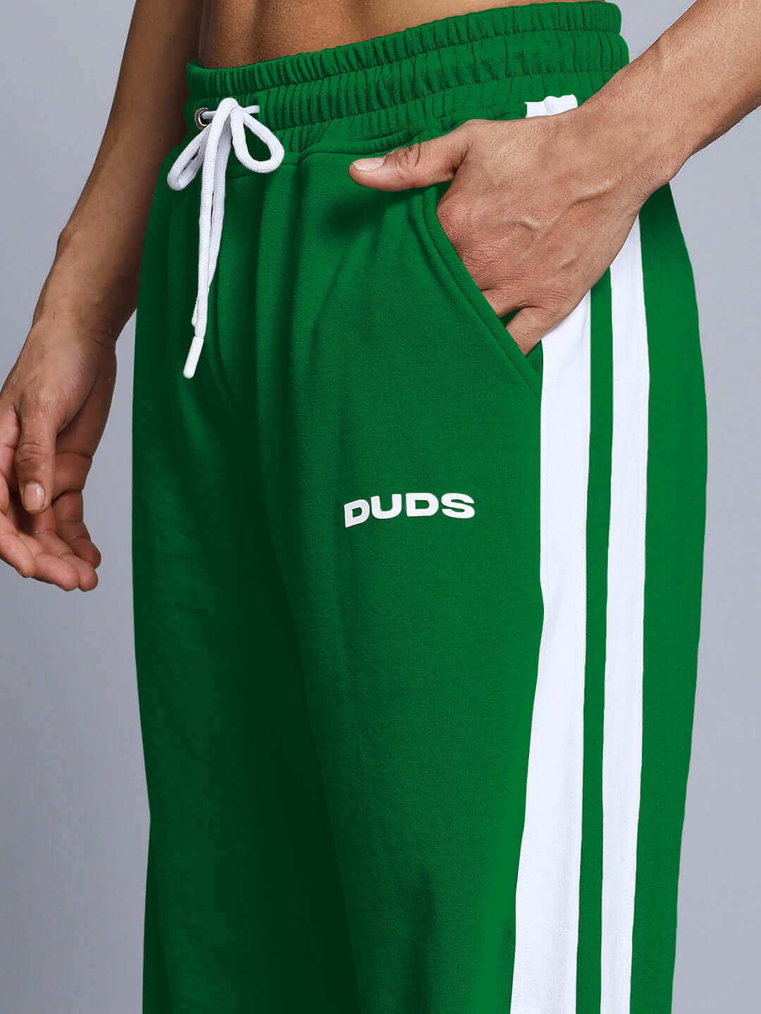 Green jogger with white side stripes, featuring DUDS logo and adjustable drawstrings.