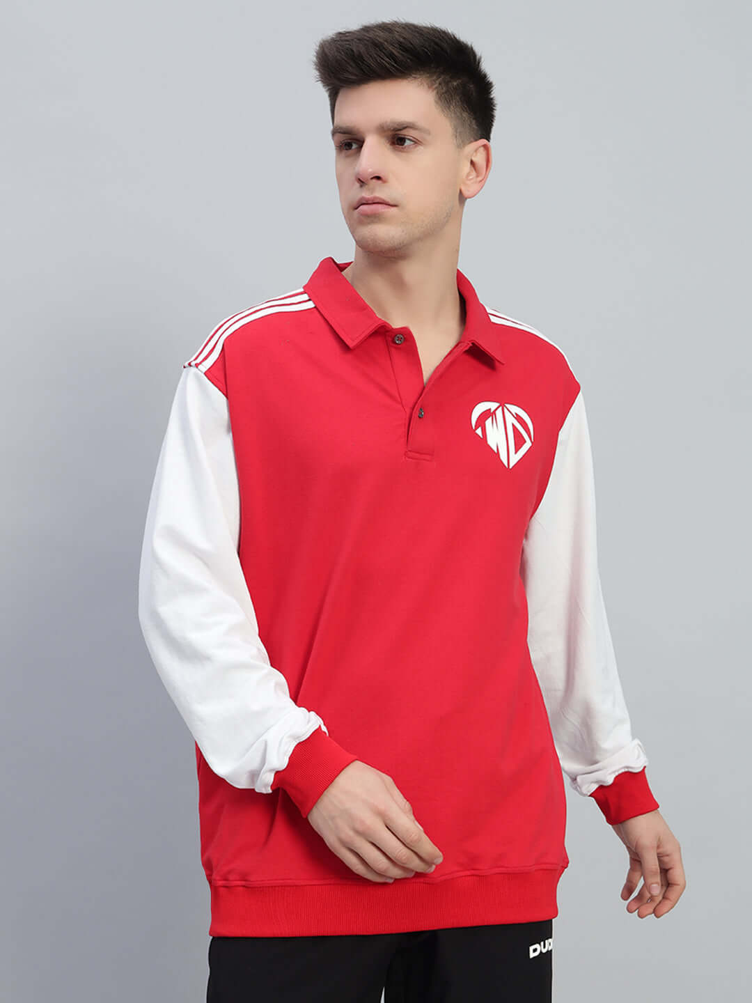 Model wearing Rowan oversized sweatshirt in red and white, featuring premium cotton fabric, long sleeves, and branded logo on chest.