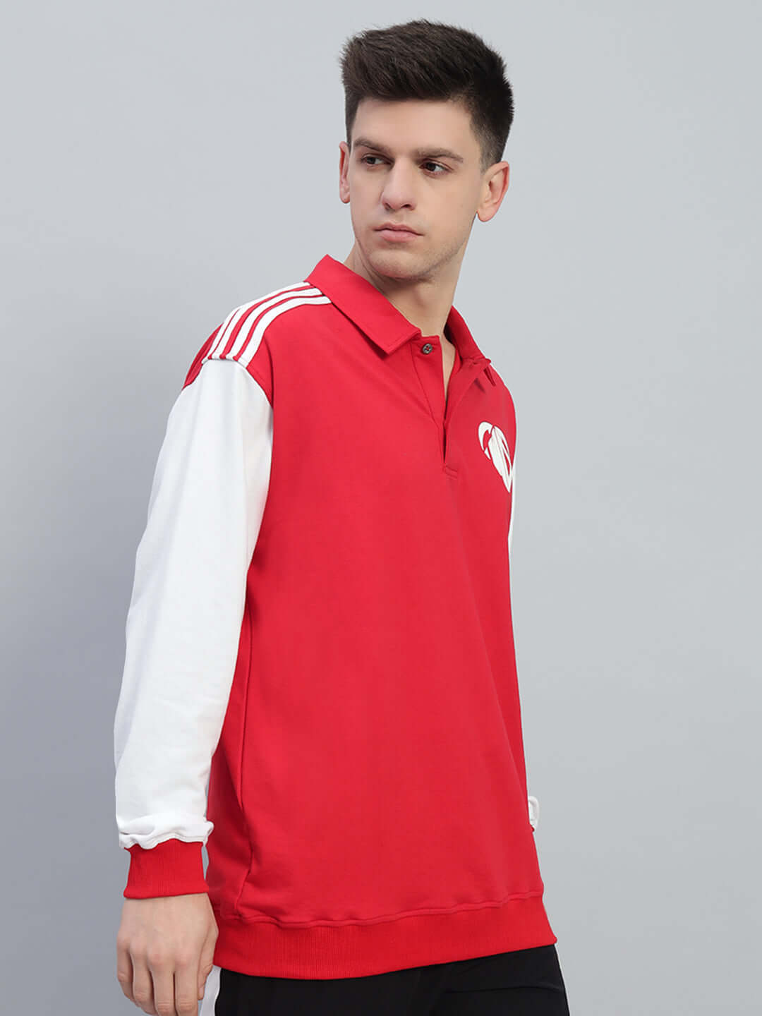 Model wearing a Rowan Oversized Sweatshirt, red with white sleeves, made from premium cotton French terry, ideal for casual wear.