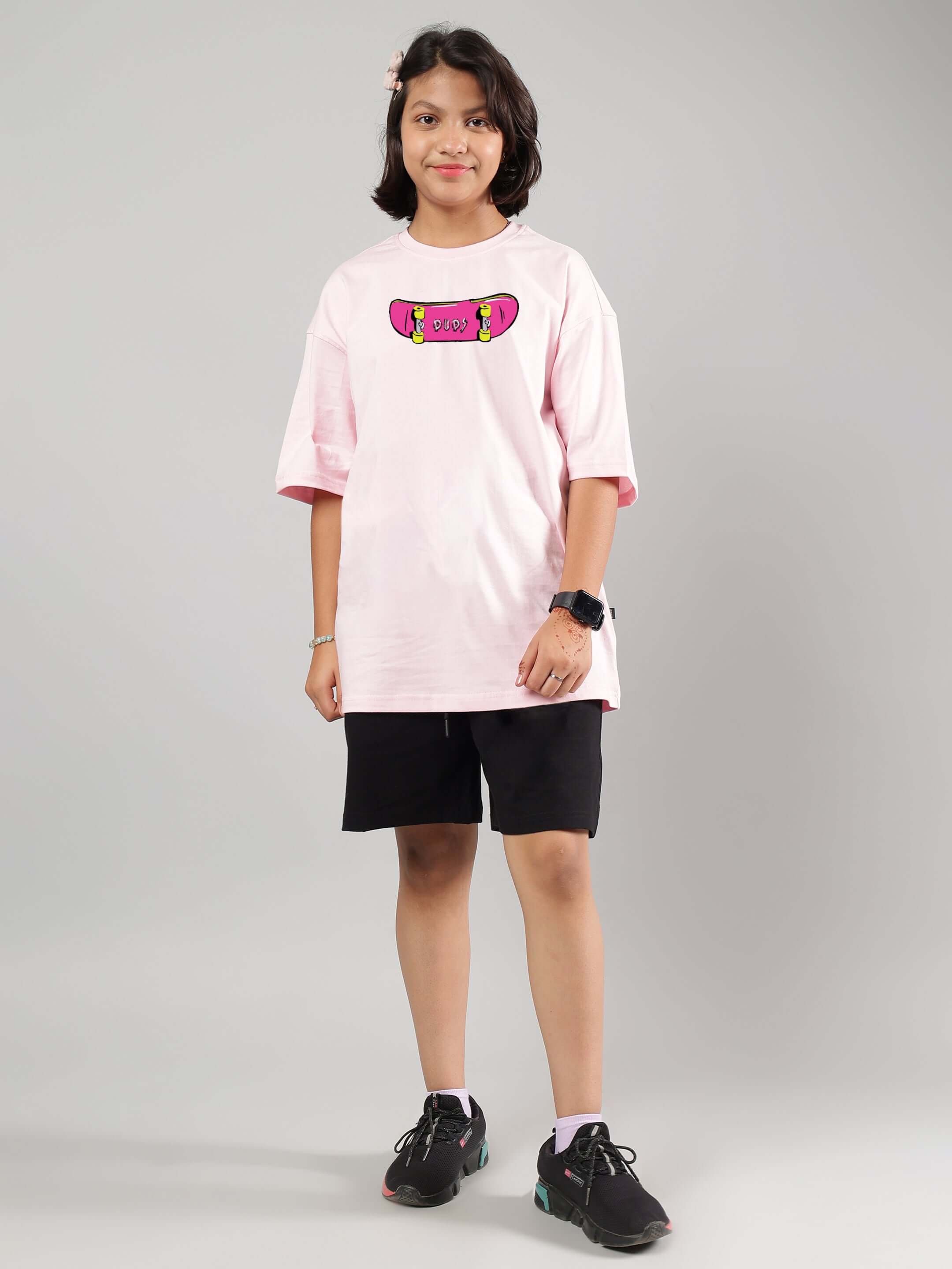 Child wearing Rowdy Ape co-ord set in pink and black, suitable for boys and girls, made by DUDS.