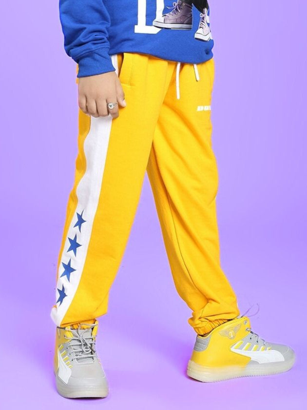 ROX PRIMER JOGGER FOR BOYS AND GIRLS YELLOW WHITE with star design on side, perfect for active kids and everyday comfort.