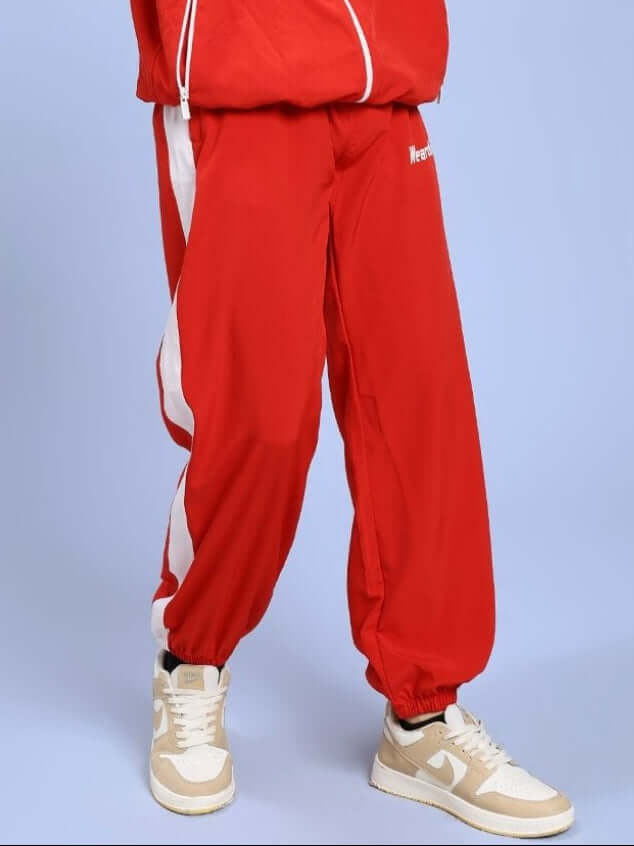 Person wearing ROYAL COMFORT RELAXED FIT JOGGER RED pants, showcasing premium style and comfort ideal for casual wear.