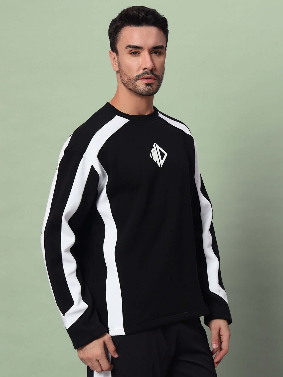 Model wearing Rugby Oversized Fleece Sweatshirt Black against a neutral background.