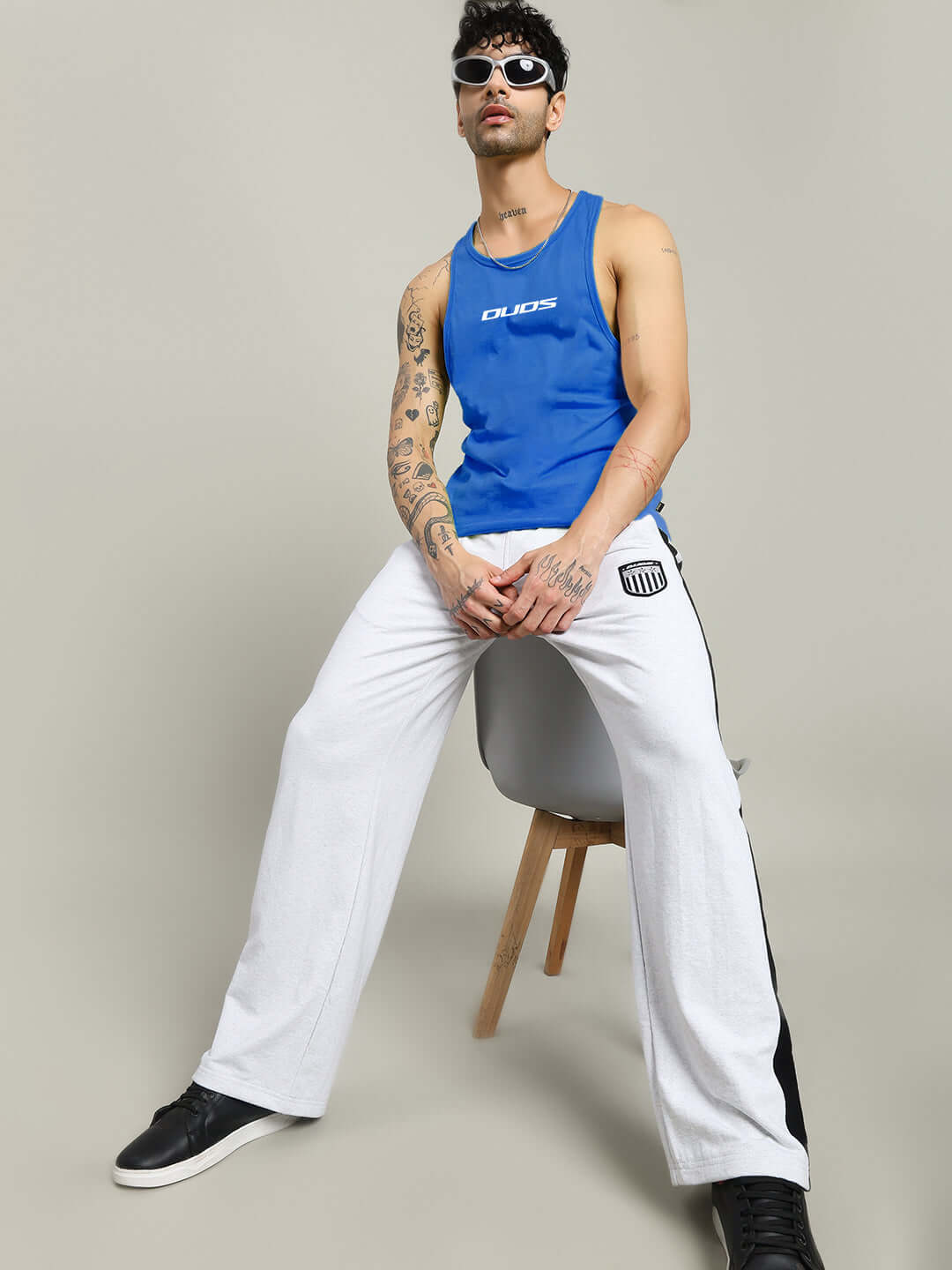 Man wearing RUN FOR LIFE SLEEVELESS GYM T-SHIRT BLUE sitting in style