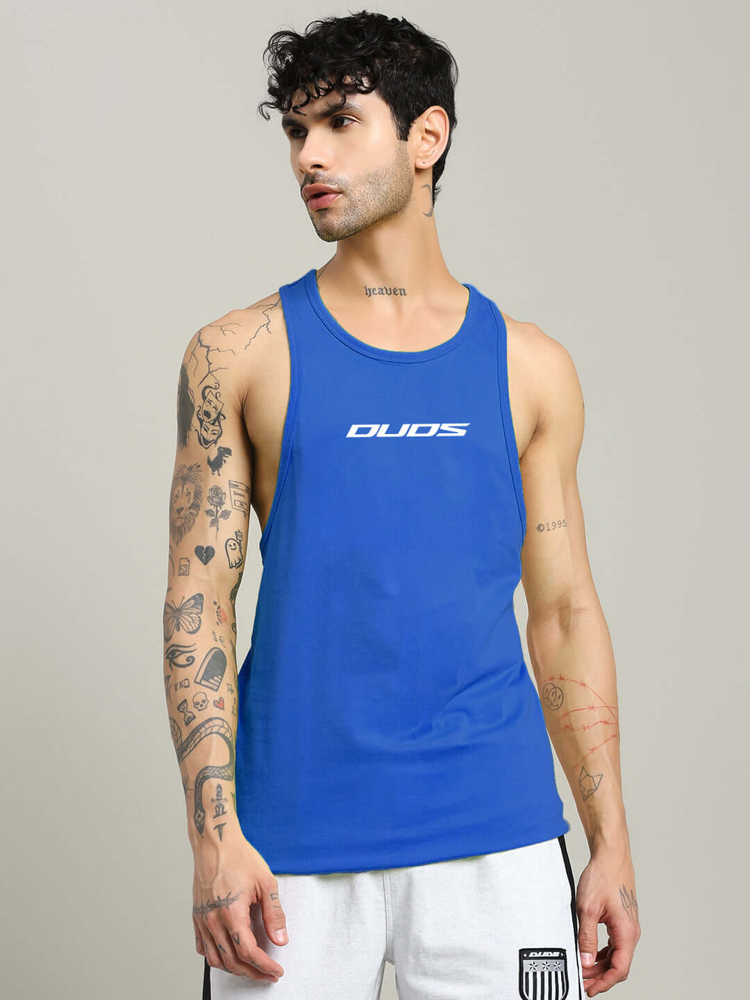 Man wearing RUN FOR LIFE SLEEVELESS GYM T-SHIRT BLUE showcasing athletic fit and vibrant color for ultimate performance and style.