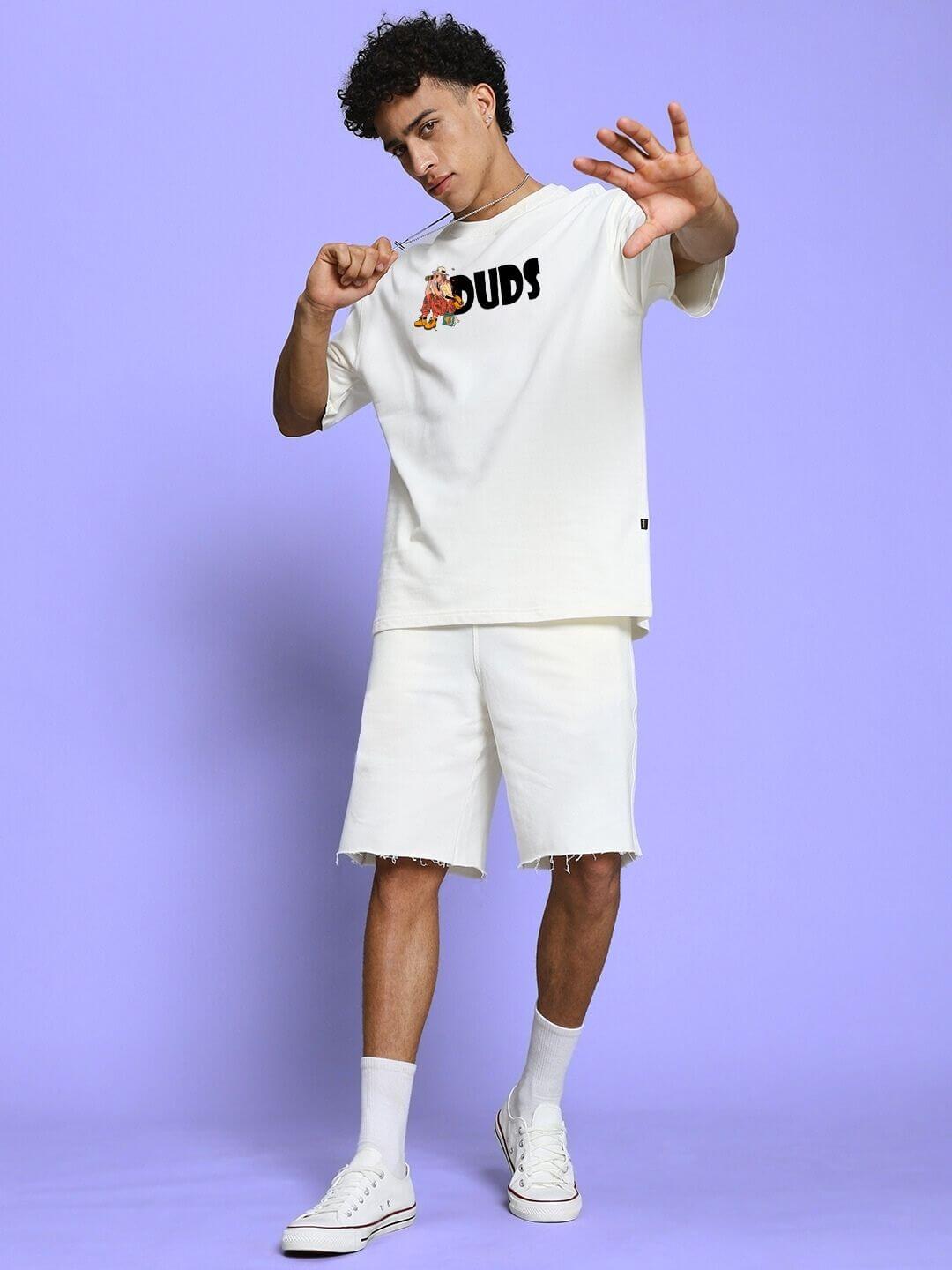 Model wearing SAFARI PRINTED CO-ORD SET OFF-WHITE, featuring oversized tee and shorts with safari-inspired prints.