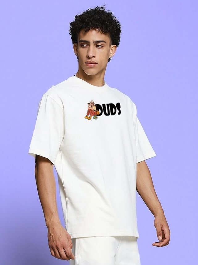 Model wearing SAFARI PRINTED OVERSIZED T-SHIRT OFF-WHITE with safari-themed graphic, on a purple background.