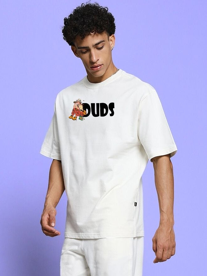 Person wearing SAFARI PRINTED OVERSIZED T-SHIRT OFF-WHITE standing against a purple background