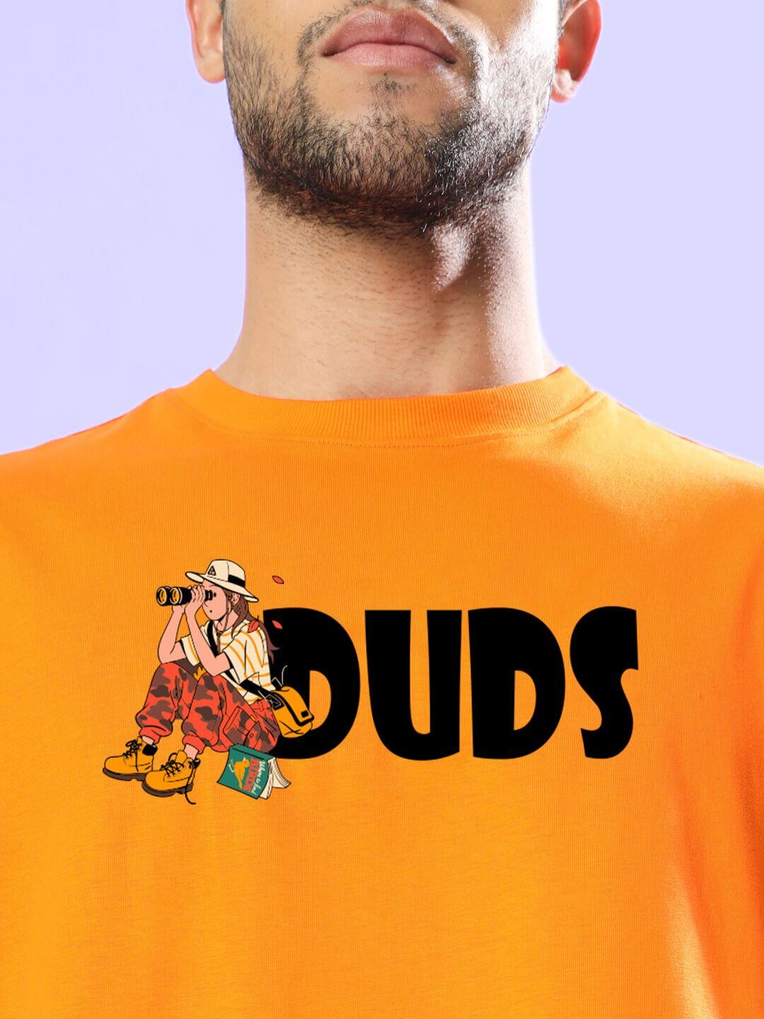 Man wearing SAFARI PRINTED OVERSIZED T-SHIRT ORANGE with bold graphic design