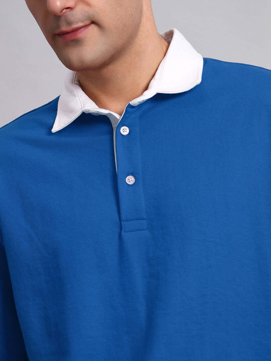 Close-up of SAGOL polo oversized sweatshirt in royal blue with white collar, showcasing heavy gauge premium cotton fabric and French terry lycra.