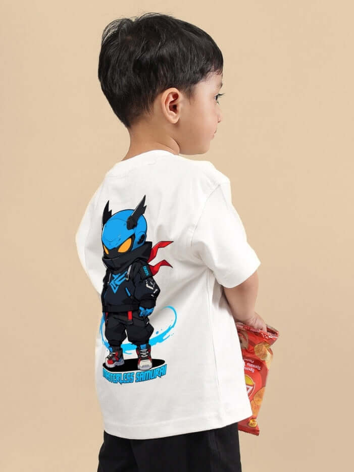 Boy wearing SAMURAI OVERSIZED T-SHIRT FOR BOYS & GIRLS OFF WHITE with a blue cartoon samurai print on the back, holding a snack.