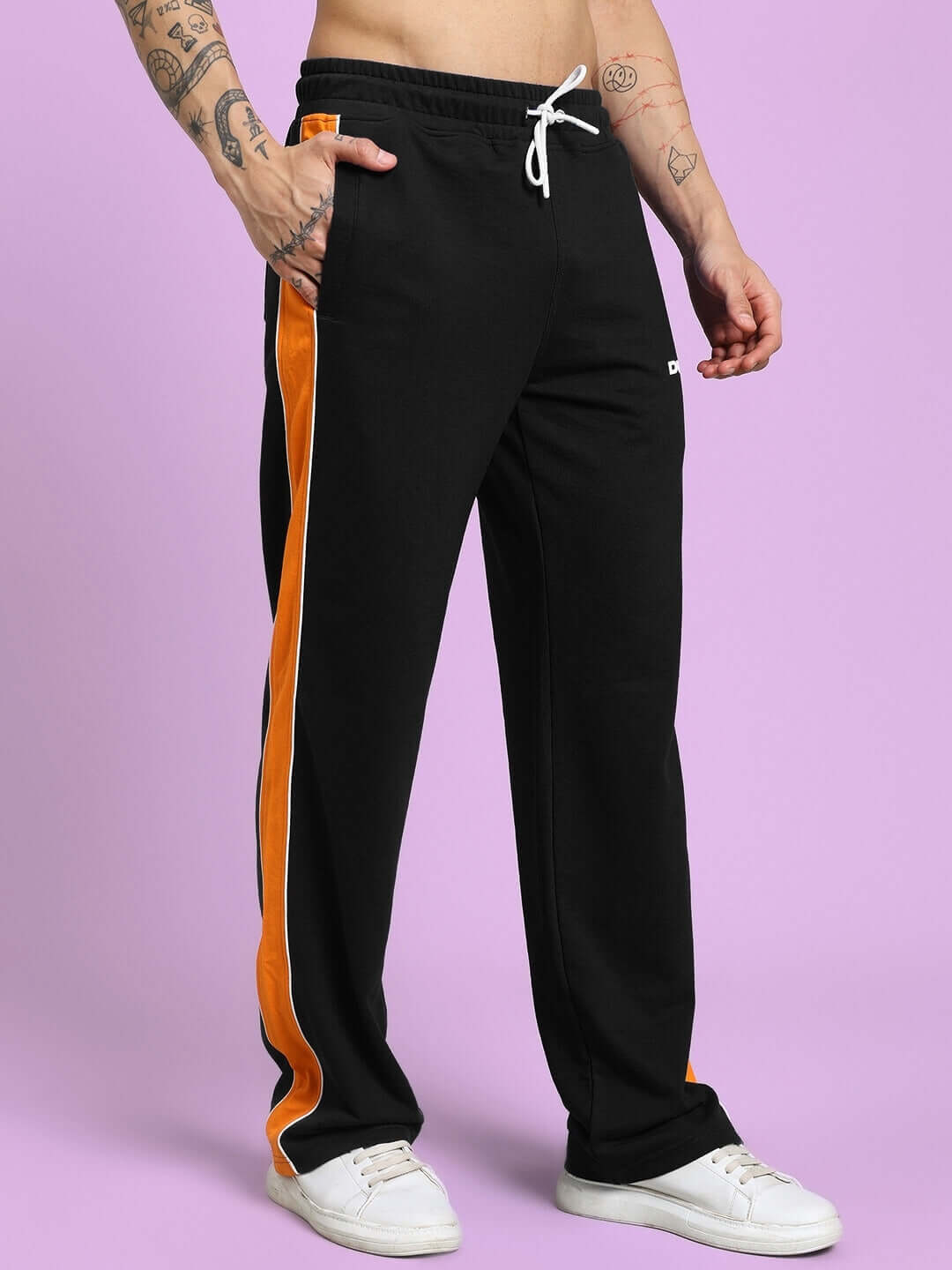 SANFORD Stripe Joggers in black with orange side stripes, customizable fit; made by DUDS, featuring durable fabric for active wear.