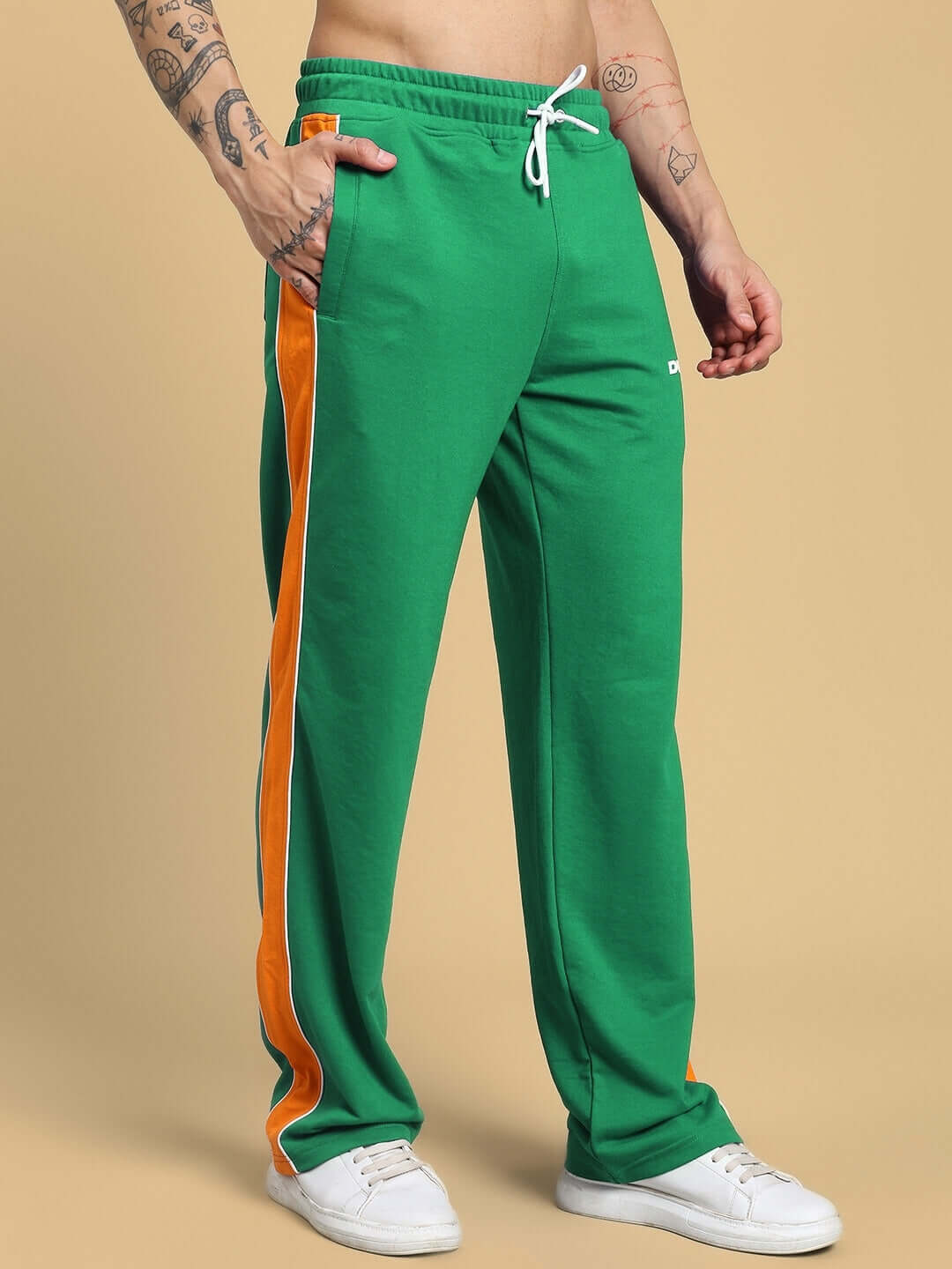 Green Sanford Stripe Joggers with orange side stripe, featuring customizable fit, crafted by DUDS tailors, men's fashion wear.