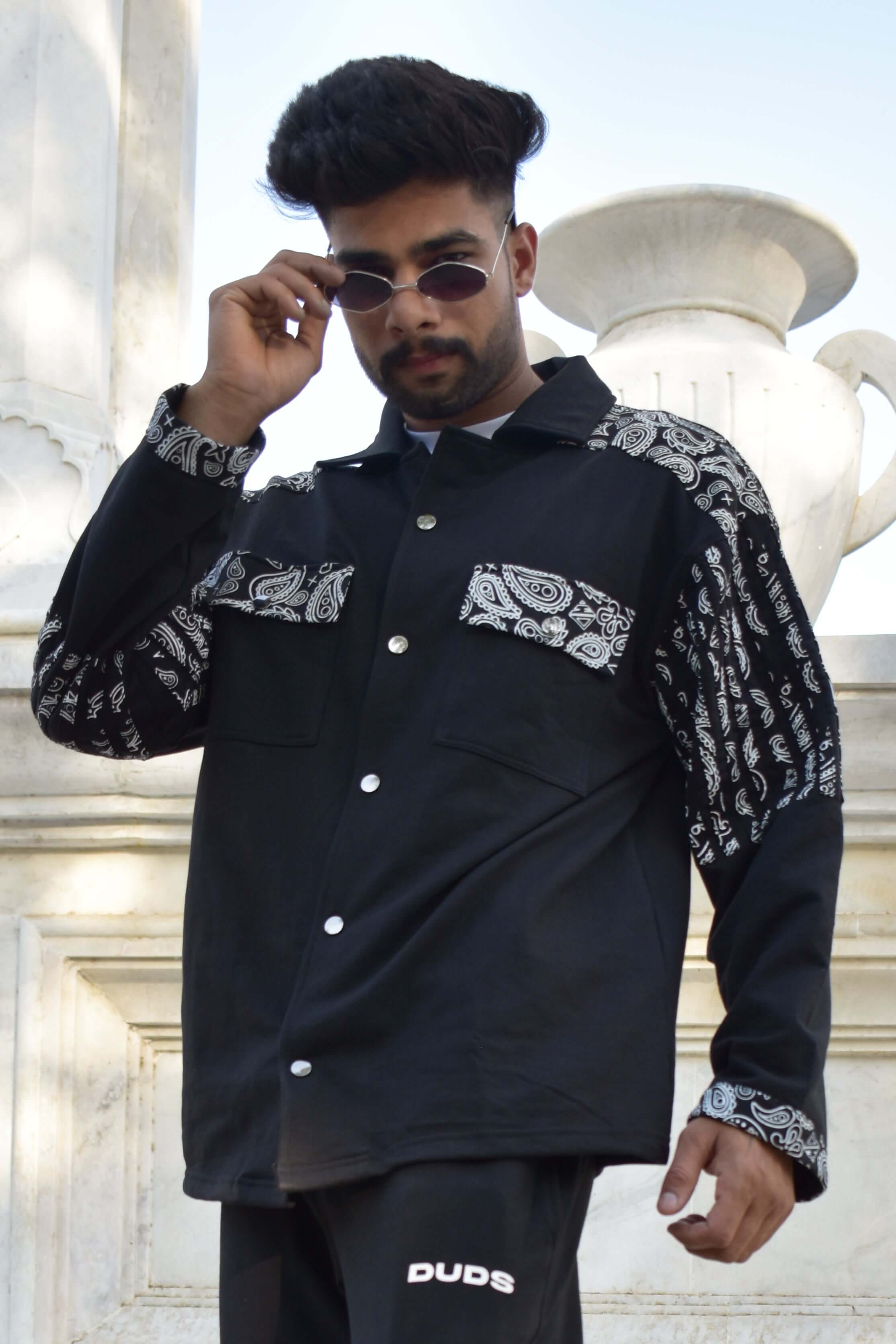 Model wearing Sanganeri black shirt with bandana pattern, made by DUDS. Available for custom fit and tailored by experienced tailors.