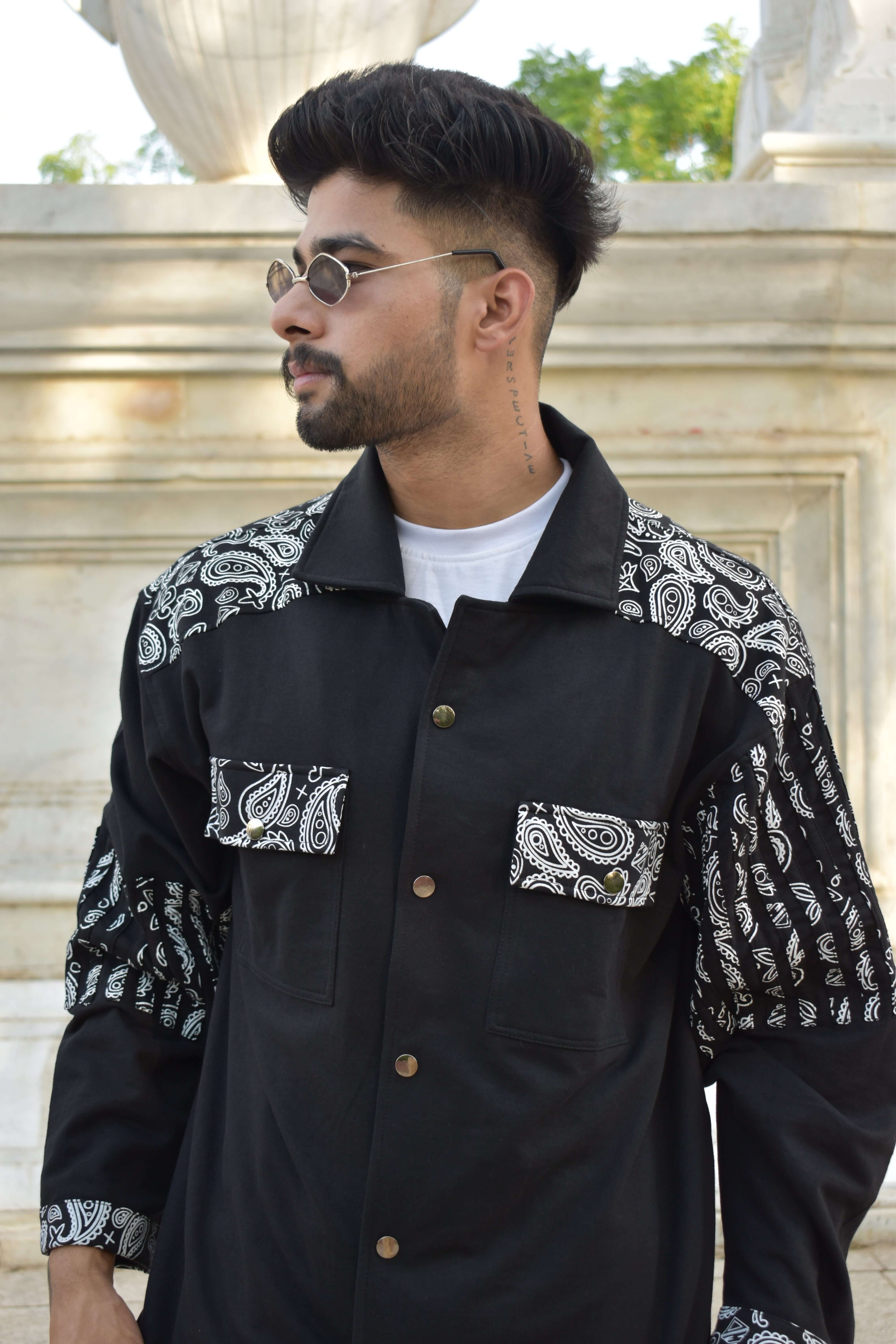 Man wearing a Sanganeri black shirt with paisley patterns from DUDS, showcasing a formal yet stylish design.