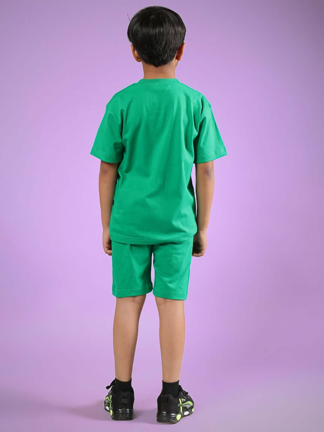 Child wearing green SATORU CO-ORD outfit for boys and girls, showcasing comfortable fit suitable for custom sizing options.