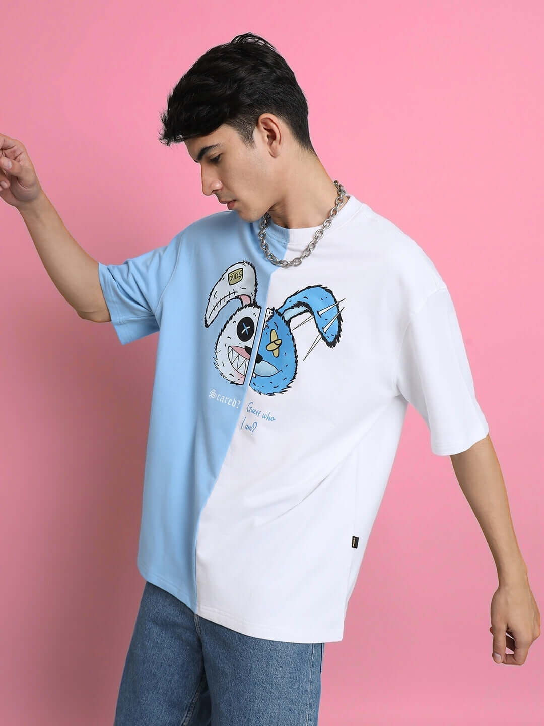 Model wearing SCARED TEDDY oversized t-shirt in sky blue and white, made of premium cotton and elastane. Fashionable and comfortable design.