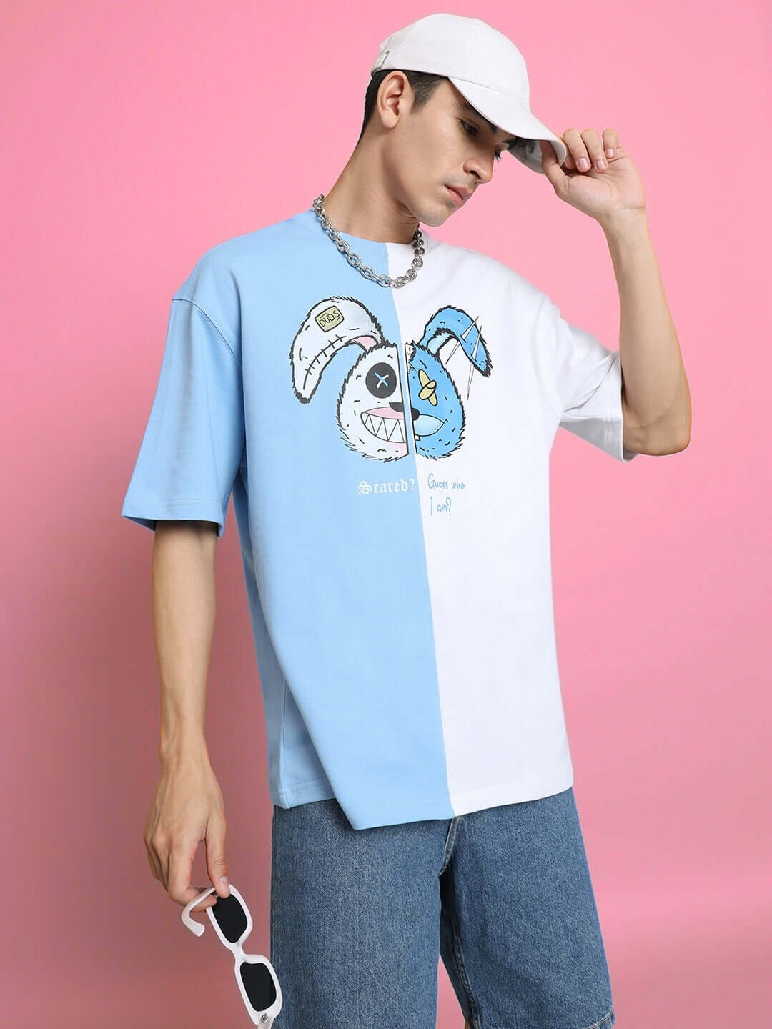 Model wearing Scared Teddy Oversized T-Shirt in sky blue and white, featuring premium cotton fabric with a graphic print on front.