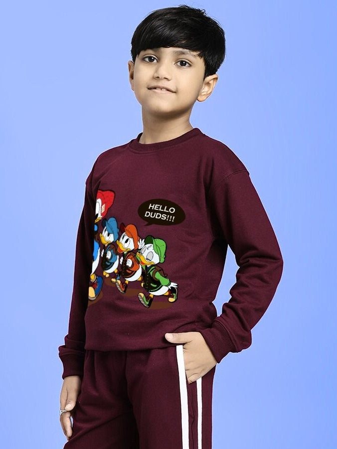 Boy wearing SCHOOL DAYS SWEATSHIRT FOR BOYS AND GIRLS MAROON with cartoon print on blue background.