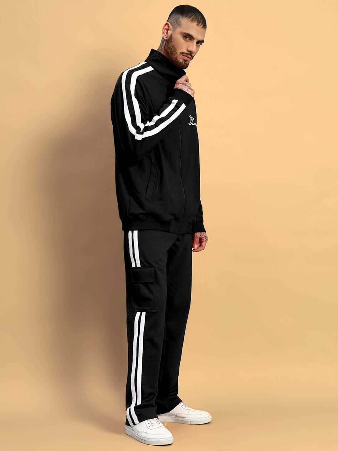 Model wearing SCOTIA Co-ord Set in black, featuring a premium cotton terry fabric with white stripes, designed by Color By Colours.