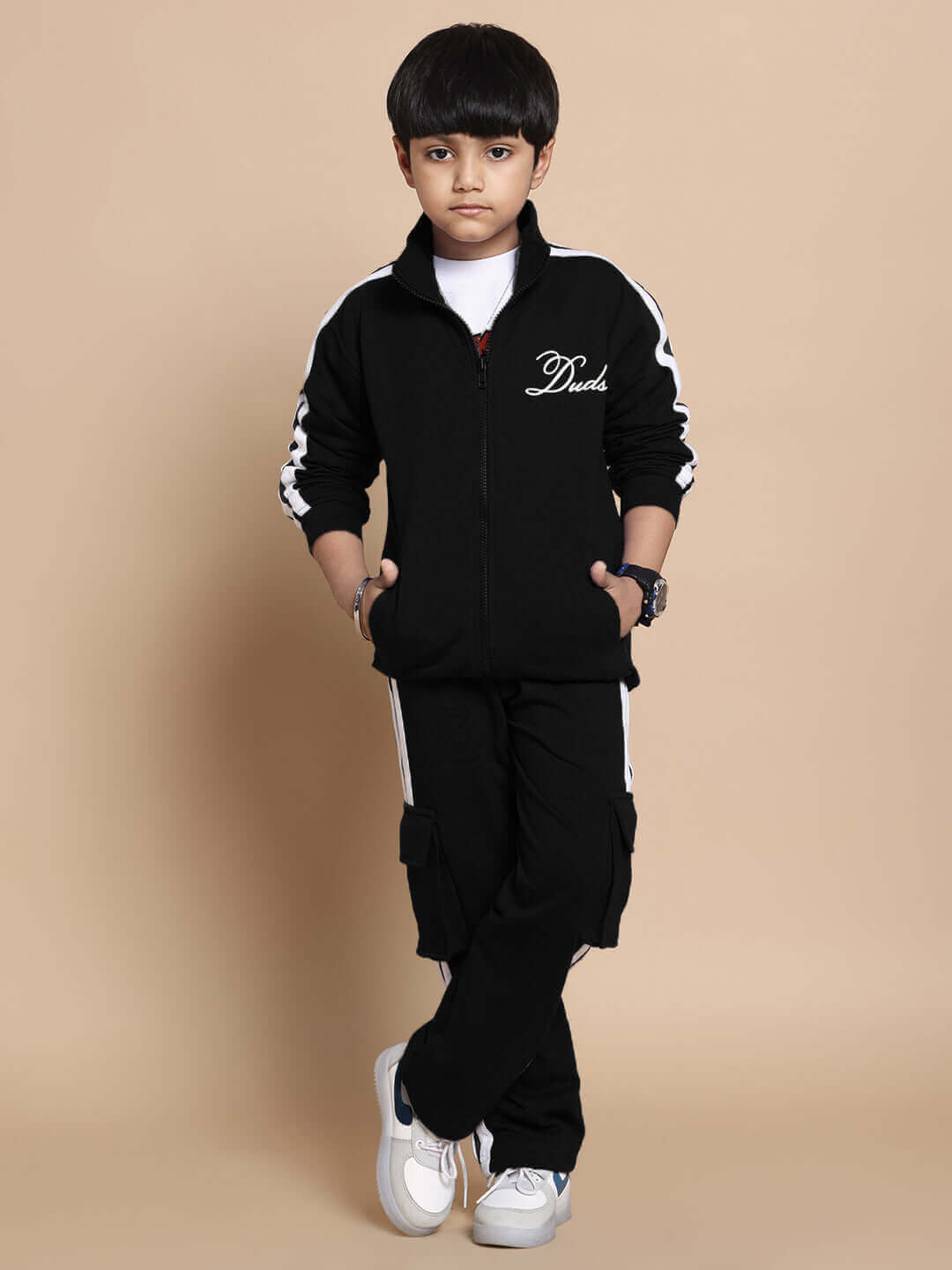 Child wearing a black unisex Scotia Co-Ord Set made of 100% cotton terry fabric, ideal for comfort and style. Perfect for boys and girls.
