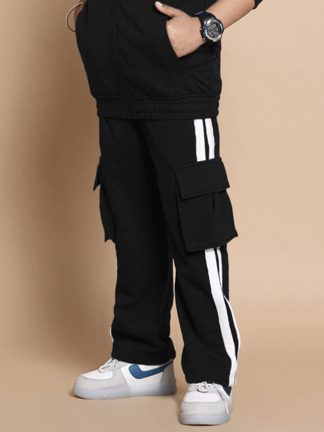 SCOTIA Co-ord Set for Boys & Girls in Black, premium cotton terry fabric, showcasing stylish cargo pants with white stripes and sneakers.