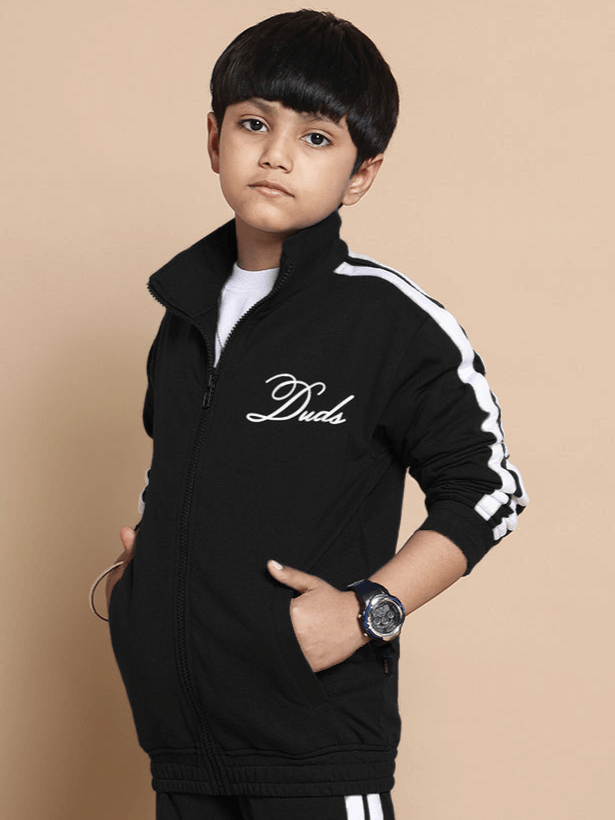 Child wearing black Scotia jacket by Duds, featuring a zip-up front and sporty design, suitable for boys and girls. Made to order.