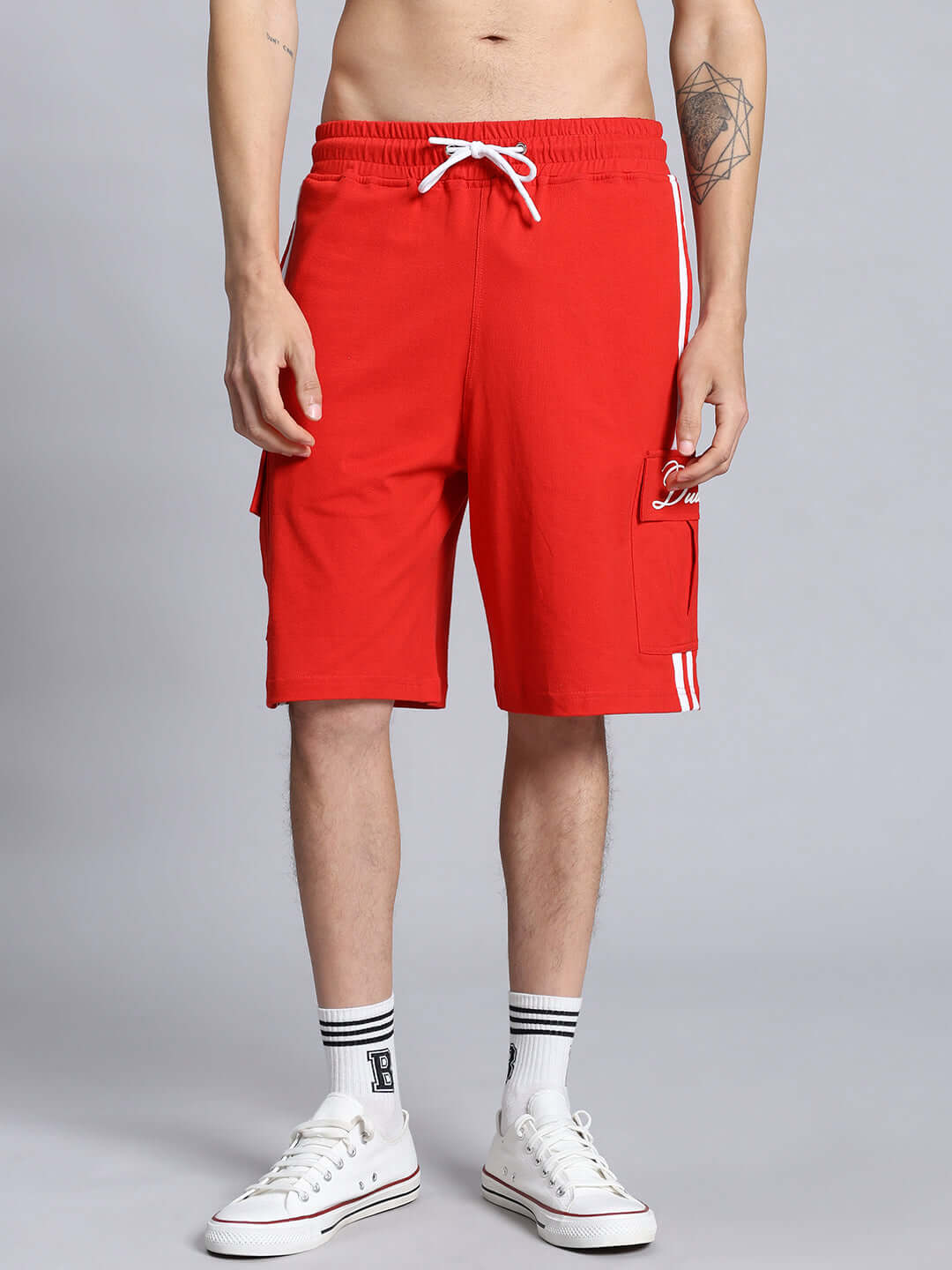Model wearing SCOTIA REGULAR FIT COTTON SHORTS RED, showing front view with drawstring and side pockets.