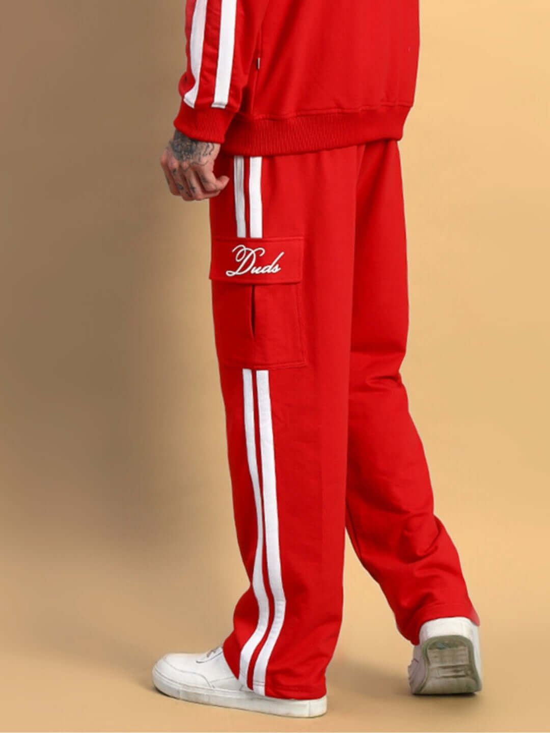 SCOTIA STRIPE JOGGERS in red with white stripes, customizable fit, made by DUDS' experienced tailors, shown with casual sneakers.