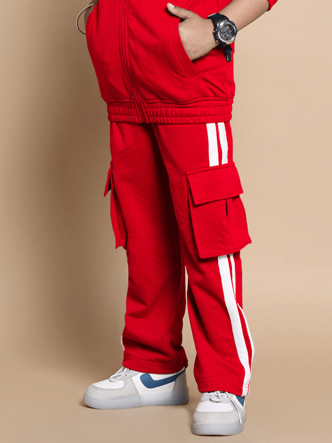 Child wearing Scotia Co-Ord Set in red with side stripes and cargo pockets, made from premium heavy gauge 100% cotton fabric.