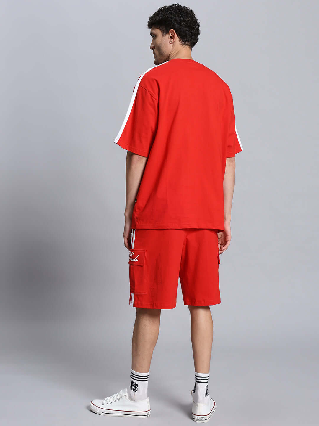 Man wearing SCOTIA SUMMER CO-ORD SET in red, featuring premium cotton fabric, rear view. Ideal for casual wear. Made in India.