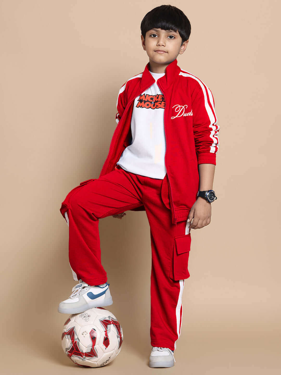 Child wearing red Scotia Co-ord Set with a soccer ball, showcasing premium 100% Cotton Terry fabric. Suitable for boys and girls.