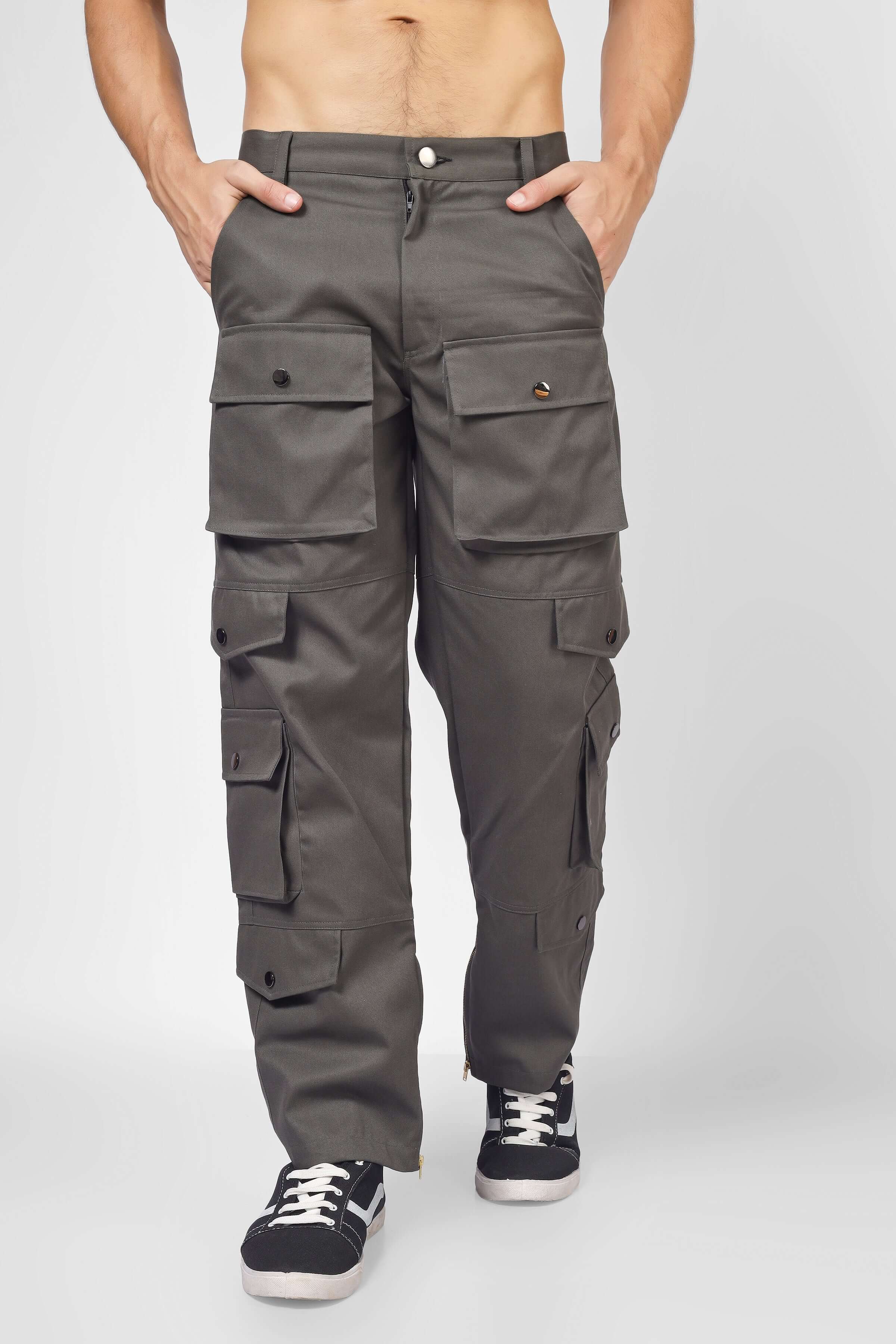 Shadow grey cargo pants with 8 pockets, tailored for custom fit by DUDS, modeled with casual sneakers. Made-to-order premium pants.