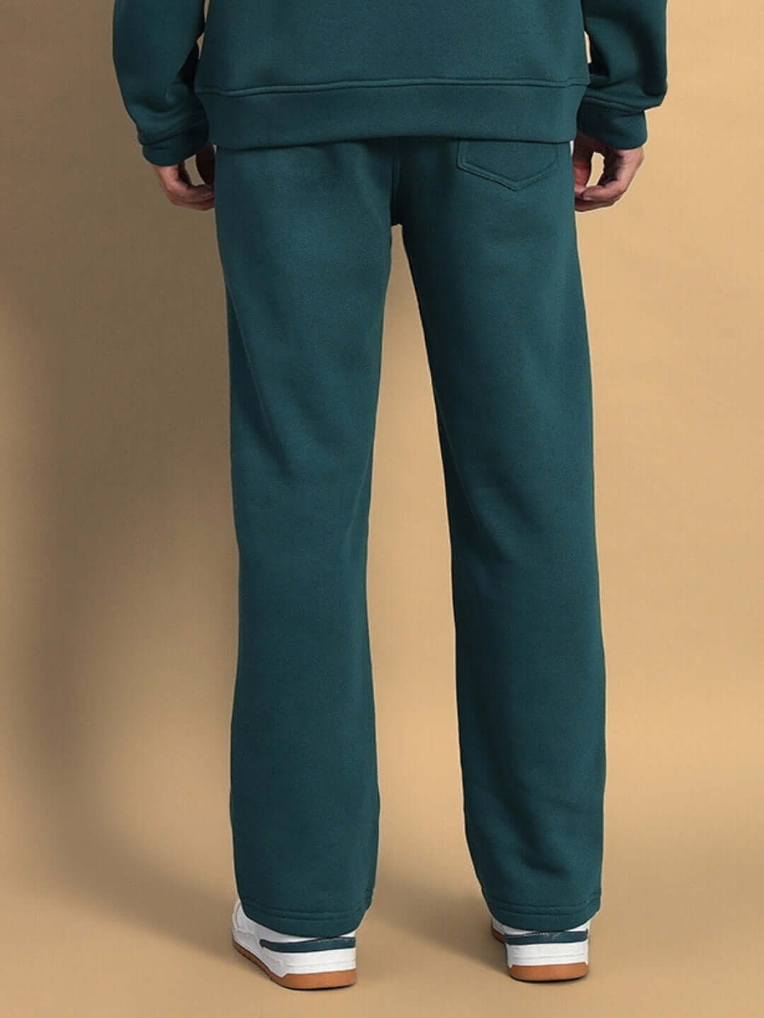 Back view of teal green shaggy fleece jogger pants showcasing comfort and style, perfect for casual wear.