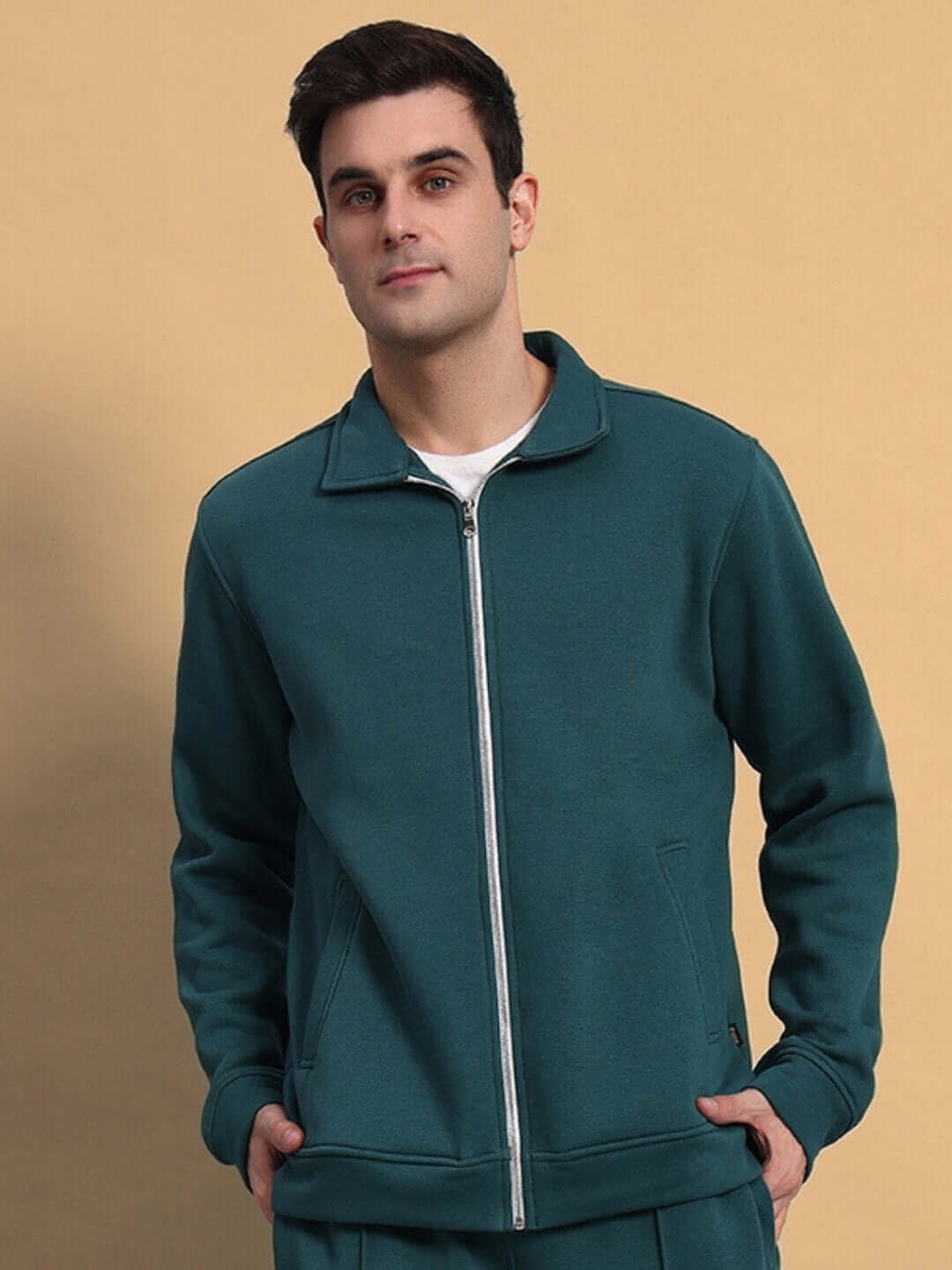 Man wearing teal green shaggy zipper fleece co-ord set, showcasing casual outfit style.