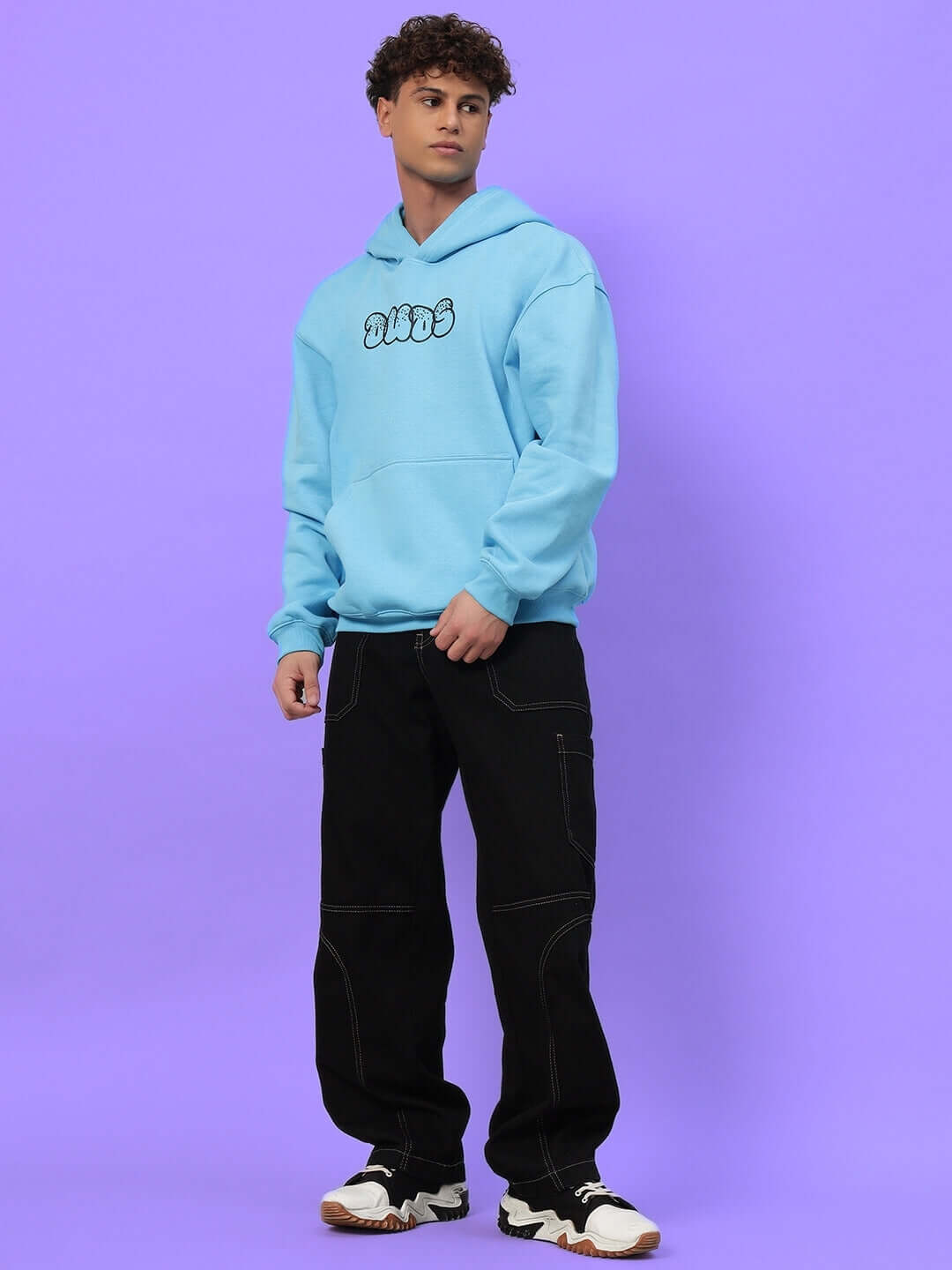 Model wearing Sharkwave Oversized Fleece Hoodie Light Blue, showcasing trendy oversized fit and premium fleece material in casual streetwear.