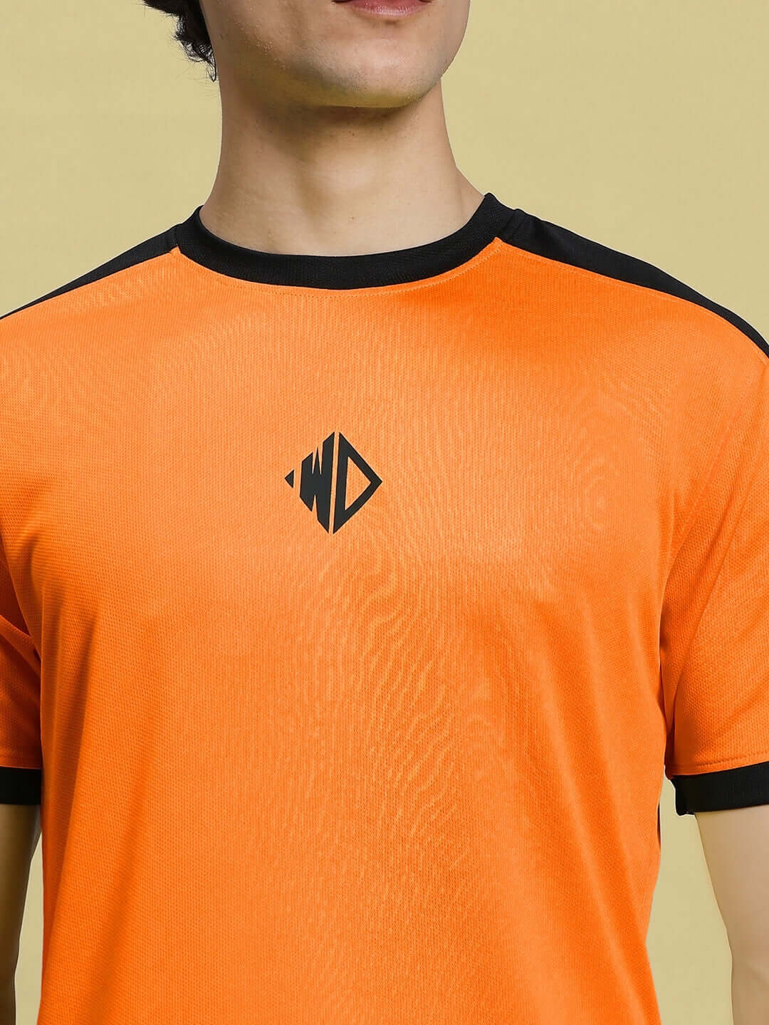 SHERPA REGULAR FIT T-SHIRT ORANGE with sports polyester fabric, ideal for casual wear. Cold machine wash recommended.