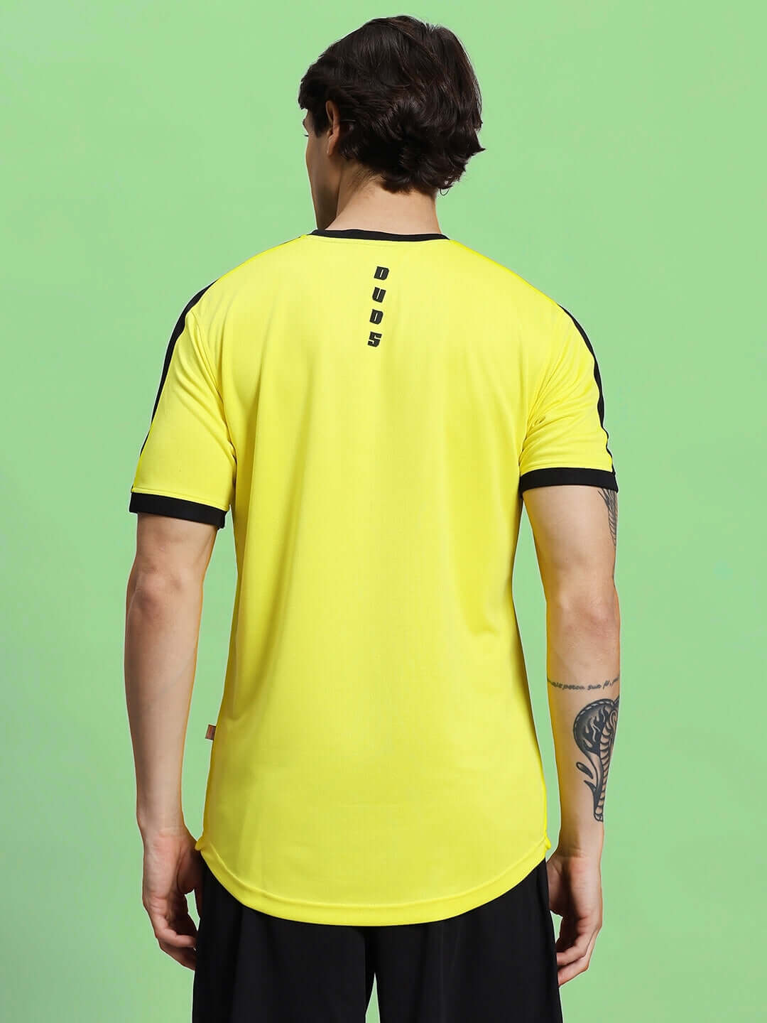 Back view of a yellow Sherpa regular fit t-shirt made from sports polyester fabric, ideal for a comfortable and stylish appearance.