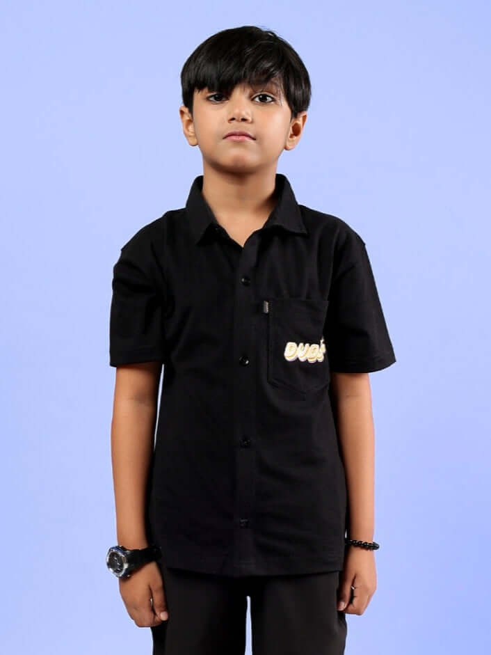 Child wearing black SHINE SHIRT by DUDS, suitable for boys and girls, custom fit option available, made-to-order with skilled tailoring.