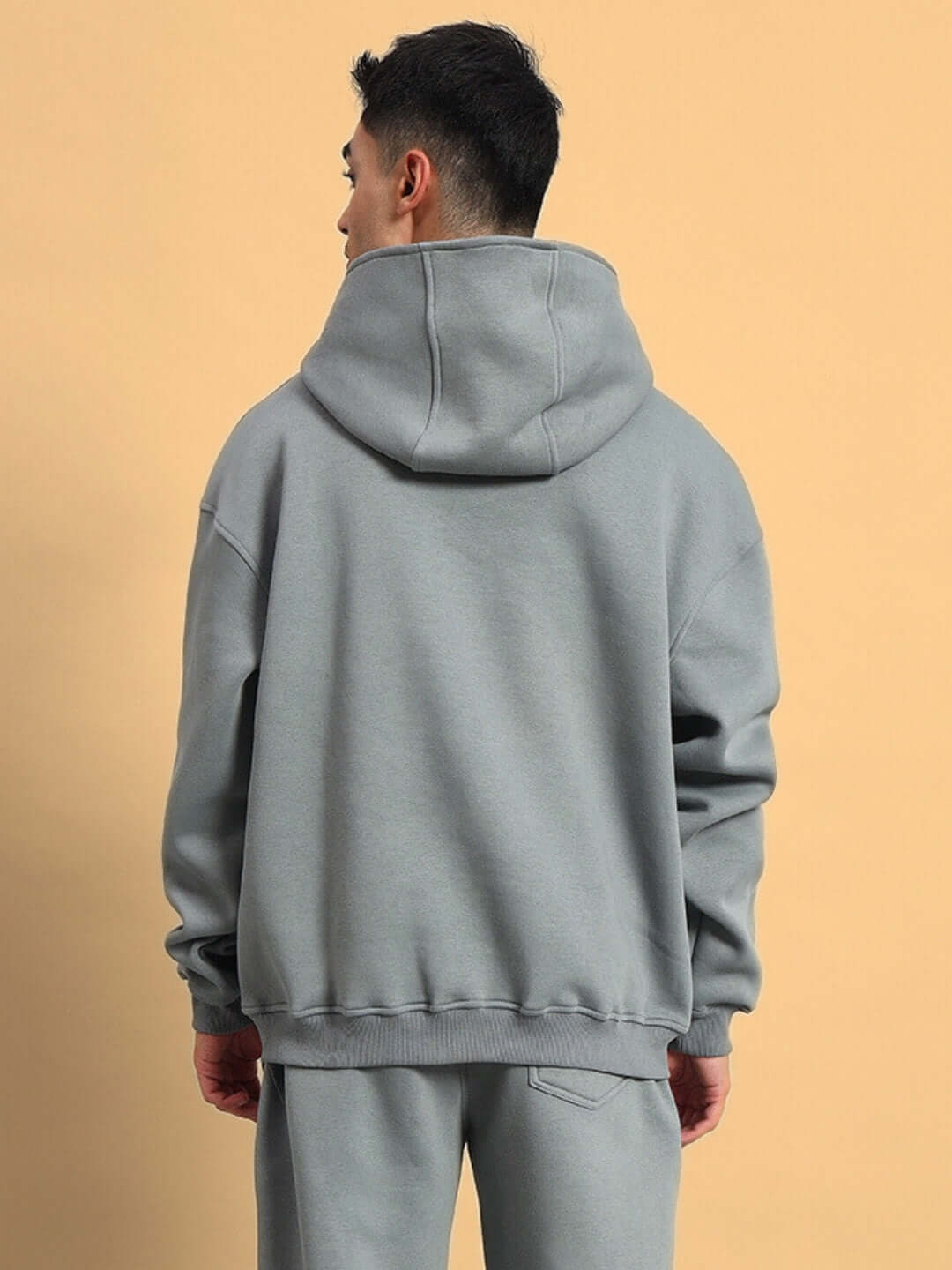 Back view of grey Shooter Fleece Hoodie by DUDS, featuring a relaxed fit and customizable size options.
