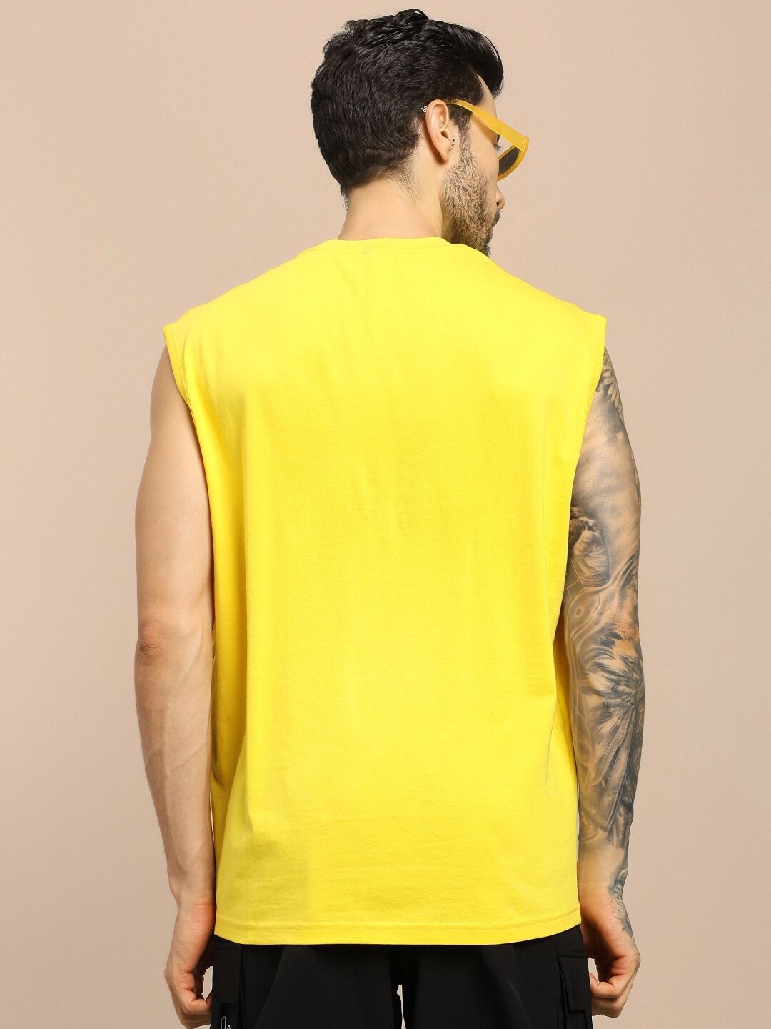 Back view of model wearing SHOOTER MONKEY GYM T-SHIRT YELLOW, showcasing vibrant color and relaxed fit.