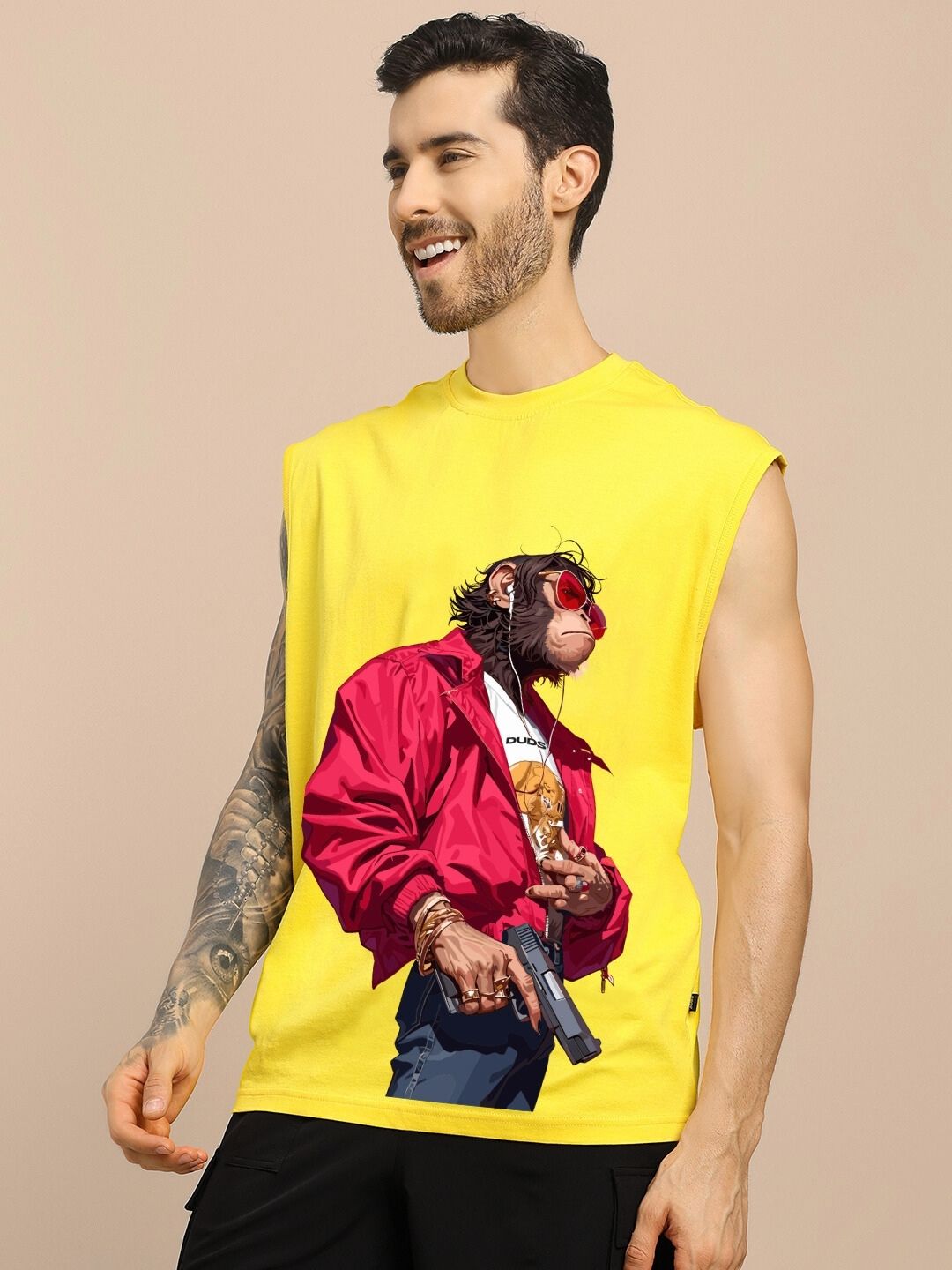 SHOOTER MONKEY GYM T-SHIRT YELLOW featuring graphic of a stylish monkey with sunglasses and jacket, worn by model with tattoos.