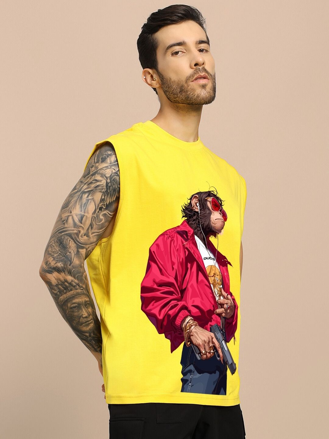 Model wearing SHOOTER MONKEY GYM T-SHIRT YELLOW with a monkey graphic and red jacket on a yellow background, sleeveless style.