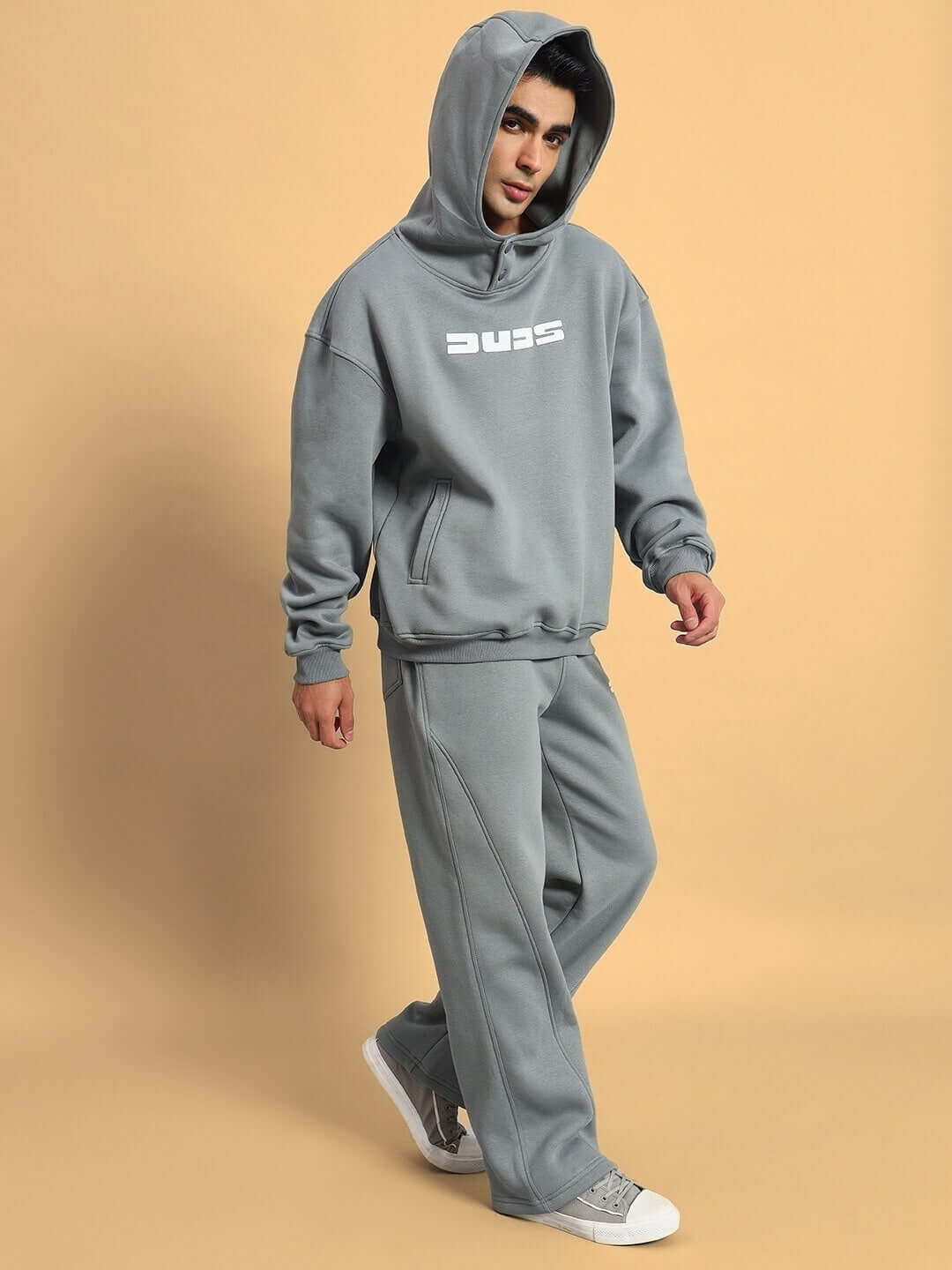 Model wearing SHOOTER COTTON FLEECE CO-ORD GREY, featuring hoodie and joggers set in premium cotton fleece for comfort and style.