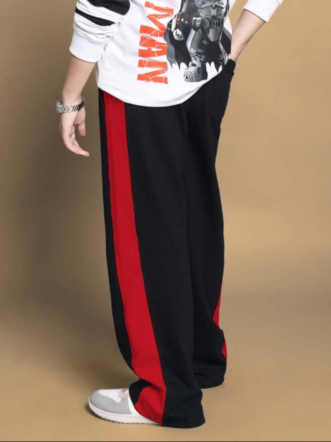Side seam baggy jogger for boys and girls in black-red, shown with casual outfit, featuring customizable fit by DUDS.