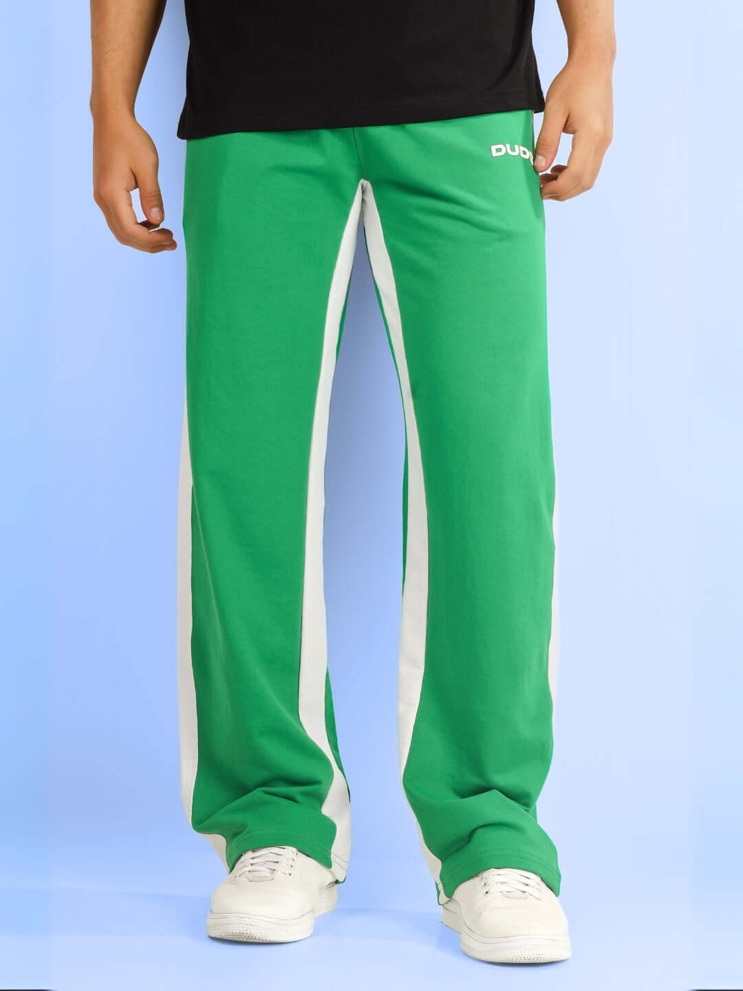 Green side seam baggy jogger pants by DUDS, customizable for perfect fit, made-to-order, worn with white sneakers.