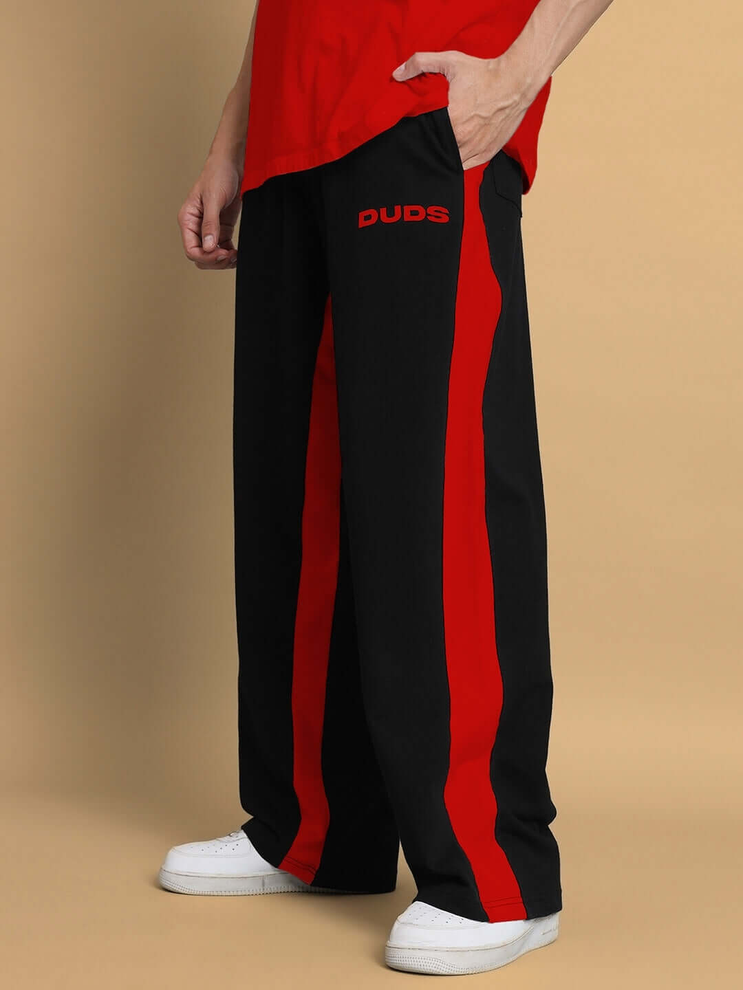 Black-red side seam baggy joggers by DUDS, featuring a relaxed fit and customizable size options for a tailored experience.